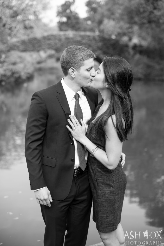 bride and groom kissing by river